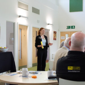 Speaker talking in front of an audience