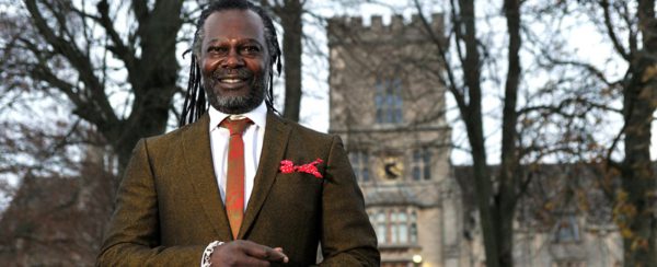 photo of Levi Roots standing in front of RAU main building